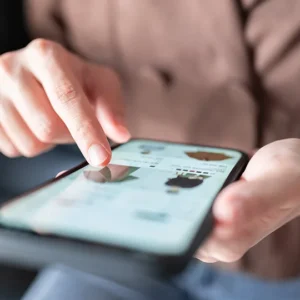 A person is playing on an ipad