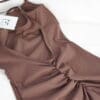 Brown sleeveless dress with gathered design.