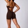Model wearing a brown sleeveless bodysuit.