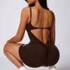 Model wearing a brown fitted outfit.