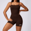 Model in brown bodysuit with logo.