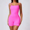 Model wearing a pink fitted outfit.