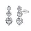 Three-stone silver earrings with round diamonds.