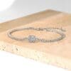 Diamond bracelet on a marble surface.