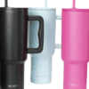 Three colorful drink tumblers in various shades.