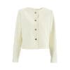 Light yellow cropped jacket with buttons.