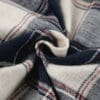 Plaid fabric in blue, white, and red.