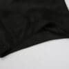 Black fabric with a hemmed edge.