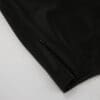 Black fabric with zipper detail.