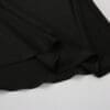 Black fabric draped on a flat surface.