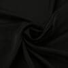 Black fabric with smooth, flowing texture.
