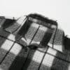Black and white flannel shirt collar close-up.