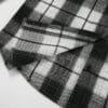 Black and white plaid flannel shirt detail.