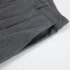 Gray tailored pants with pleated design.