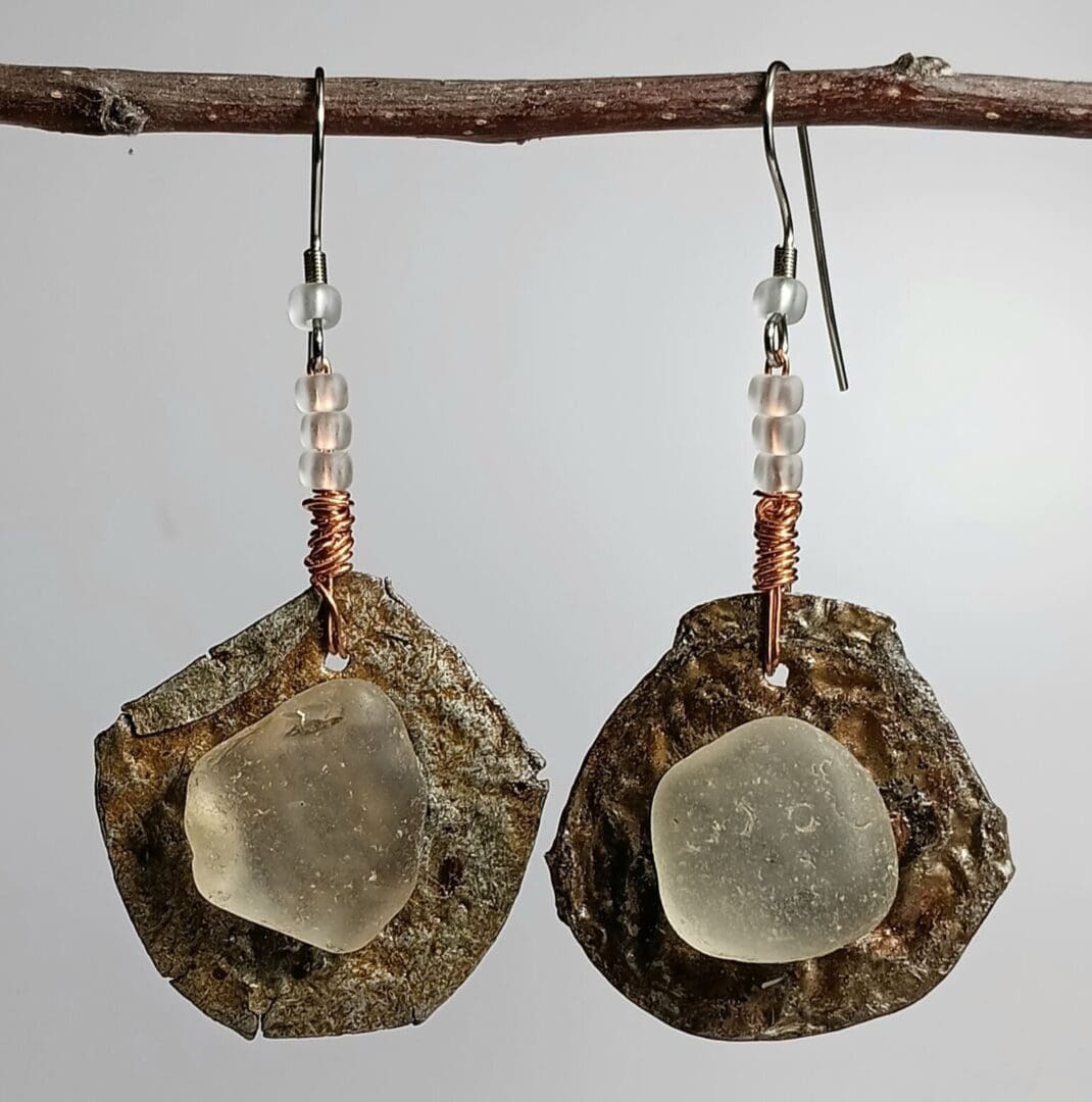Handmade earrings with sea glass and beads.